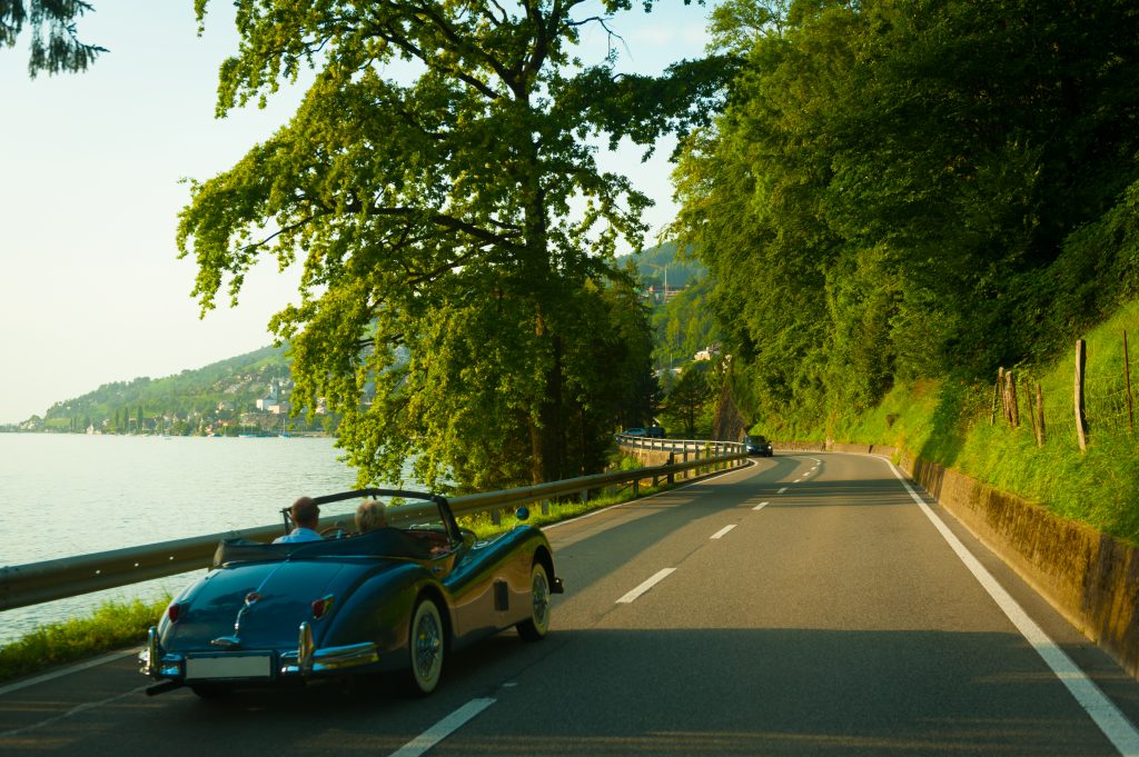 Retro car riding on the road